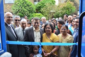 Mahesh Ramniklal Shah & Family led the opening of the doors,